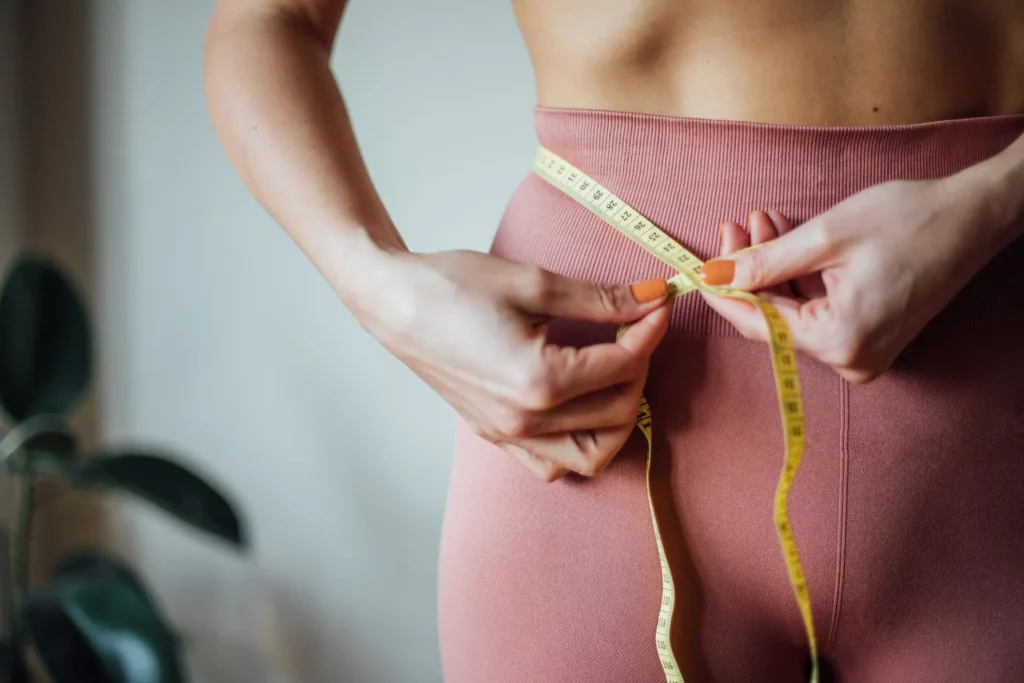 Woman Measuring Her Waist