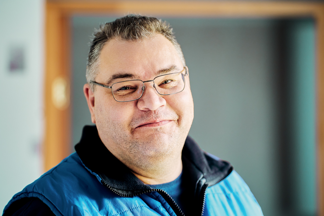 Smiling Man, with large fat face.